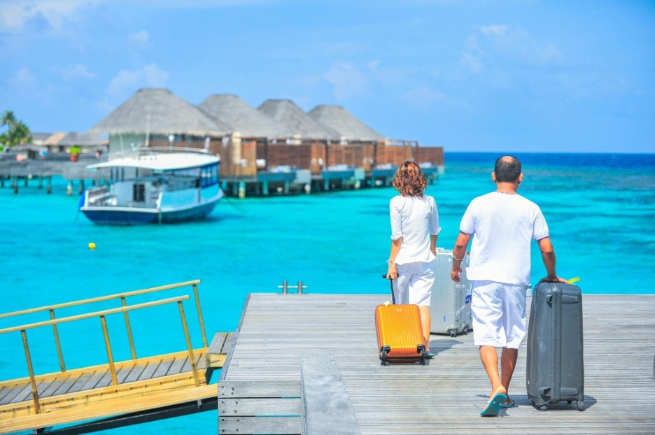 two people walking on the pier