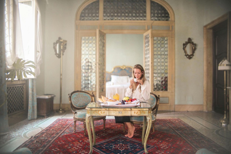 Woman sitting and enjoying a cup of coffee